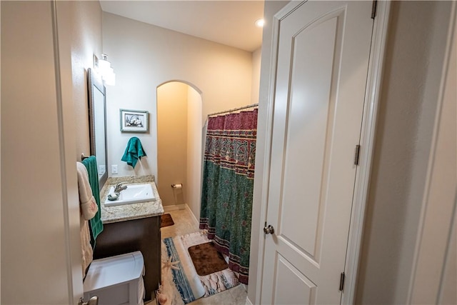 full bathroom with vanity and a shower with shower curtain