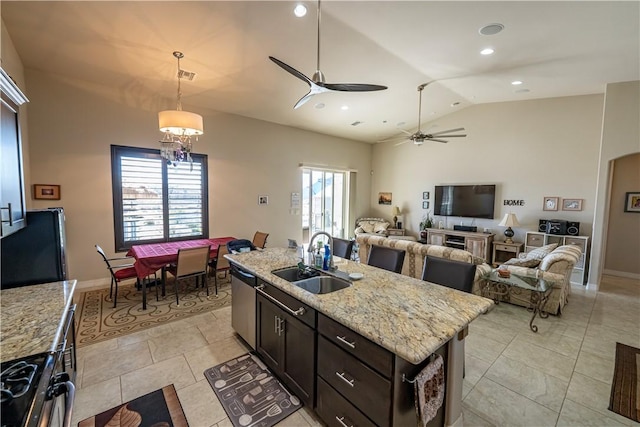 kitchen with a sink, gas stove, dishwasher, high vaulted ceiling, and light tile patterned flooring