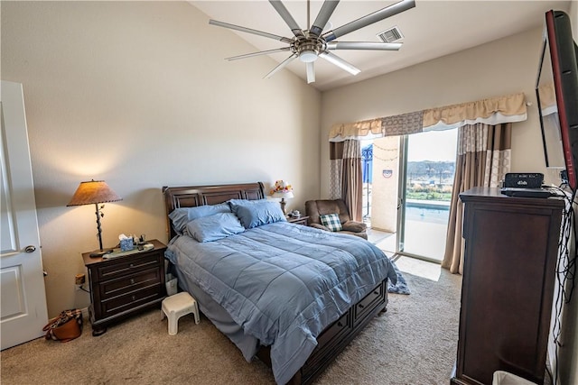 bedroom featuring light carpet, access to outside, and a ceiling fan