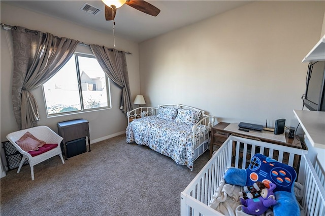 carpeted bedroom with baseboards and a ceiling fan