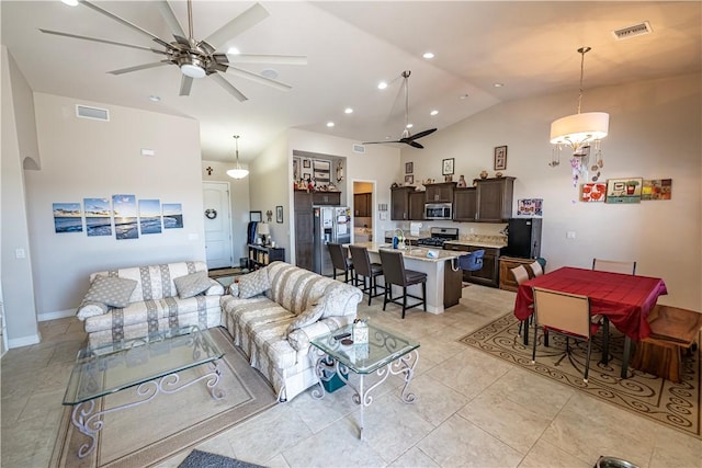 living area featuring a ceiling fan, high vaulted ceiling, recessed lighting, and light tile patterned floors