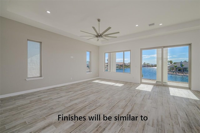 6175 S Los Lagos Bay Bay, Fort Mohave, AZ 86426 - empty room featuring light wood-style floors, ceiling fan, recessed lighting, baseboards, and a water view