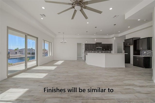 6175 S Los Lagos Bay Bay, Fort Mohave, AZ 86426 - unfurnished living room featuring a chandelier, a ceiling fan, recessed lighting, and light wood-style floors