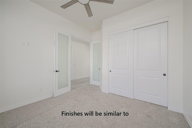 6175 S Los Lagos Bay Bay, Fort Mohave, AZ 86426 - unfurnished bedroom featuring carpet, a closet, baseboards, and ceiling fan