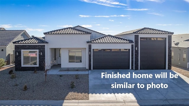 6175 S Los Lagos Bay Bay, Fort Mohave, AZ 86426 - mediterranean / spanish-style house with a garage, driveway, stucco siding, and a tiled roof