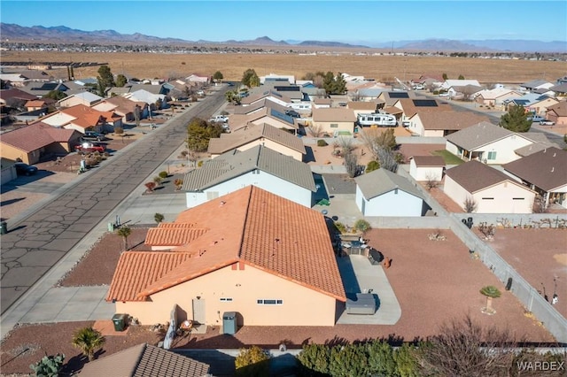 drone / aerial view featuring a residential view and a mountain view