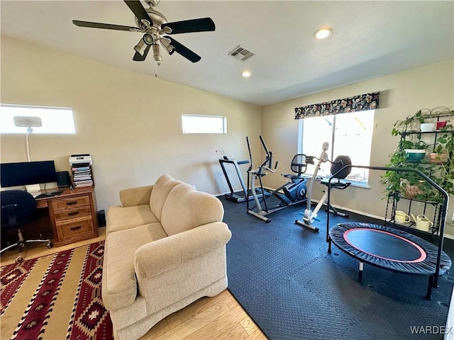 exercise area with baseboards, visible vents, a ceiling fan, vaulted ceiling, and recessed lighting