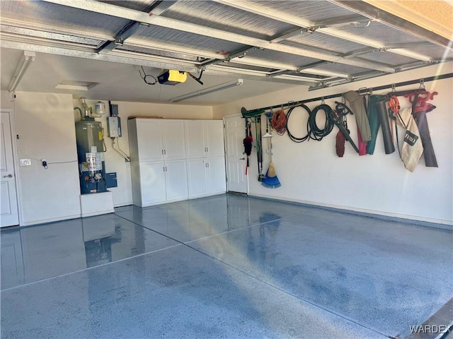 garage with gas water heater and a garage door opener