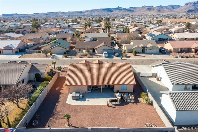 birds eye view of property with a residential view and a mountain view