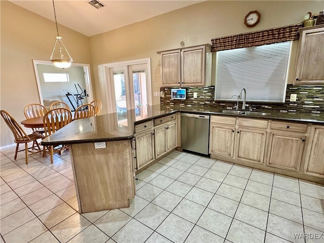 kitchen with pendant lighting, light tile patterned flooring, a sink, dishwasher, and a peninsula