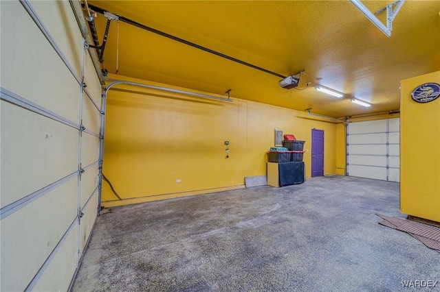 garage featuring a garage door opener