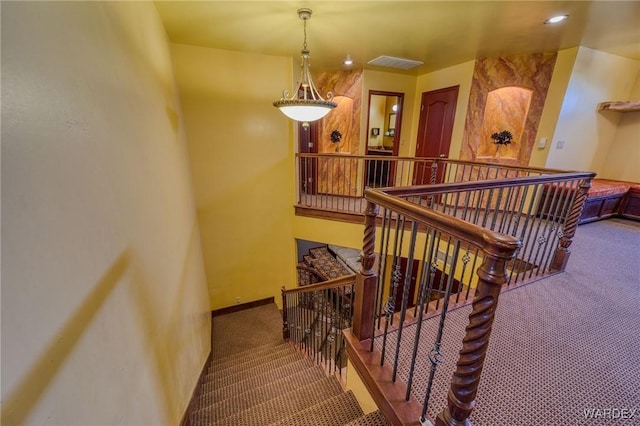 stairs with carpet floors, recessed lighting, visible vents, and baseboards