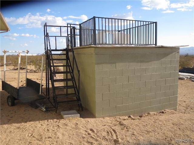 exterior space with concrete block siding