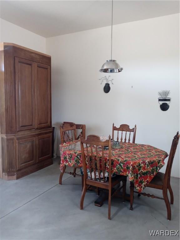 dining room with concrete floors