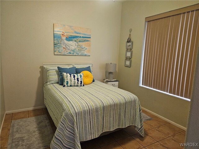 tiled bedroom with baseboards