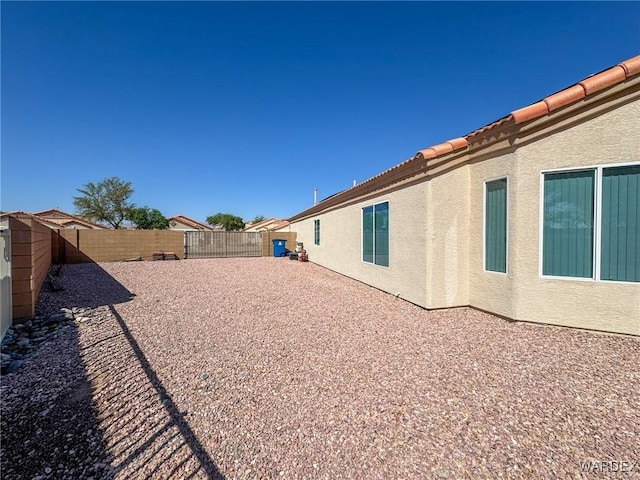 view of yard featuring a patio area and a fenced backyard