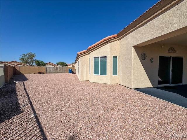 view of yard with a patio area and a fenced backyard