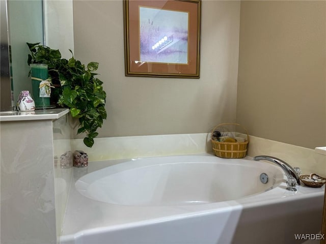 bathroom with a garden tub