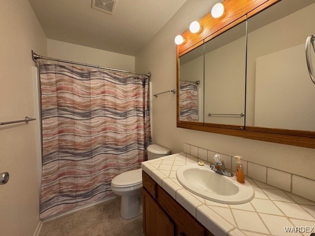 1280 Mohave Dr Unit 8A, Bullhead City, AZ 86442 - full bathroom with visible vents, toilet, vanity, and a shower with shower curtain