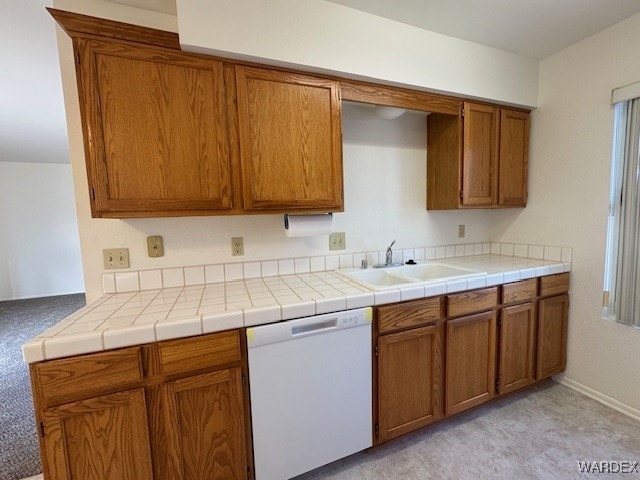 1280 Mohave Dr Unit 8A, Bullhead City, AZ 86442 - kitchen featuring a sink, brown cabinets, light countertops, and white dishwasher