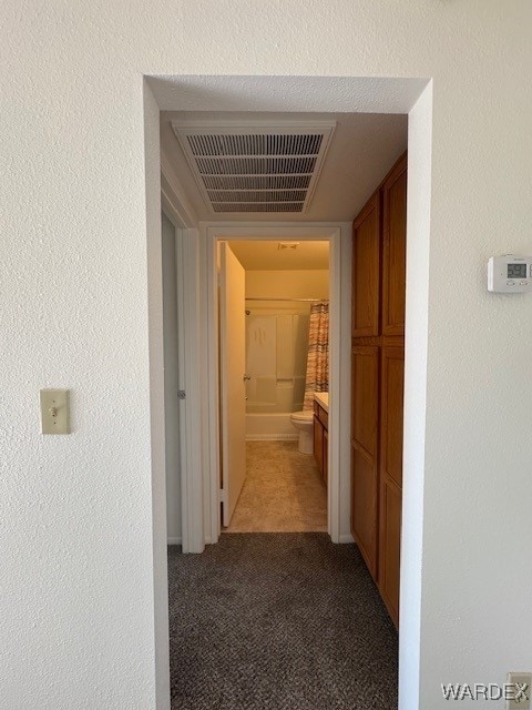1280 Mohave Dr Unit 8A, Bullhead City, AZ 86442 - hall featuring visible vents, light colored carpet, and a textured wall
