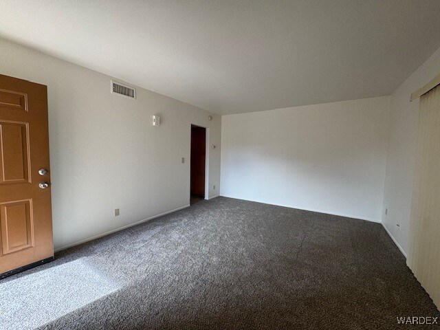 1280 Mohave Dr Unit 8A, Bullhead City, AZ 86442 - unfurnished room featuring carpet flooring and visible vents