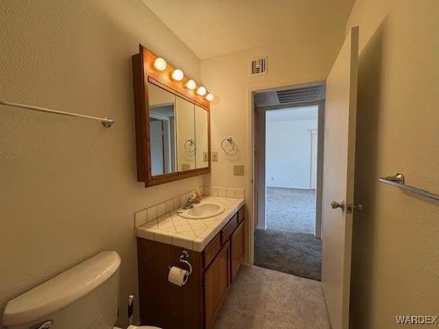 1280 Mohave Dr Unit 8A, Bullhead City, AZ 86442 - half bathroom with vanity, toilet, and visible vents