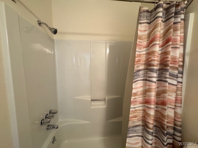 1280 Mohave Dr Unit 8A, Bullhead City, AZ 86442 - bathroom featuring shower / bath combo with shower curtain