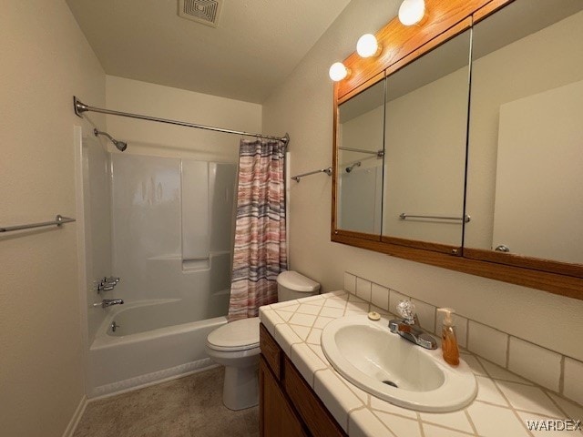 1280 Mohave Dr Unit 8A, Bullhead City, AZ 86442 - bathroom with visible vents, baseboards, toilet, shower / bath combo, and vanity