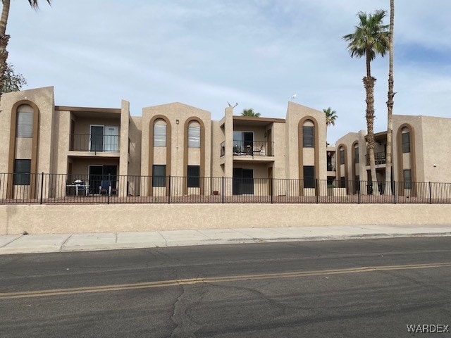 1280 Mohave Dr Unit 8A, Bullhead City, AZ 86442 - view of building exterior featuring fence