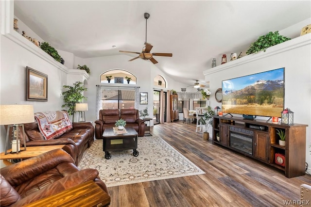 living room with lofted ceiling, ceiling fan, and wood finished floors