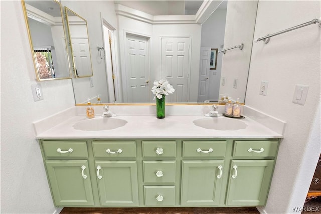 full bathroom featuring double vanity and a sink