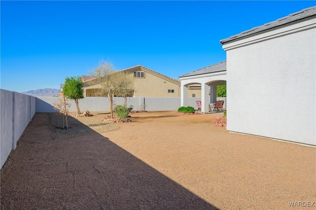 view of yard with a patio area and a fenced backyard