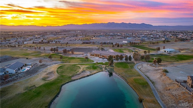 drone / aerial view with a water and mountain view