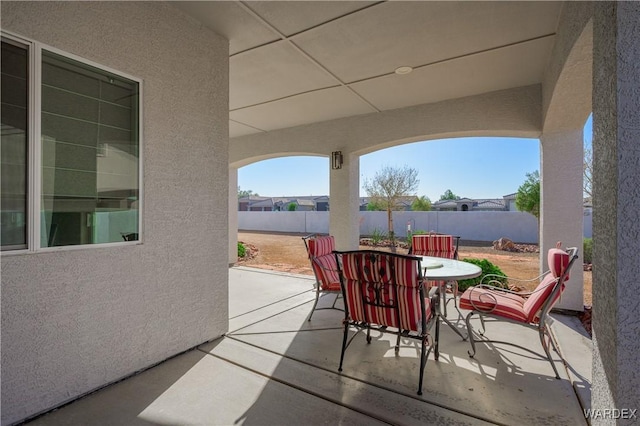 view of patio with outdoor dining space and a fenced backyard