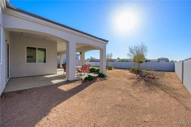 view of yard with a patio area and a fenced backyard