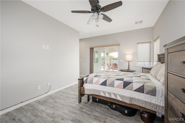 bedroom featuring baseboards, visible vents, ceiling fan, wood finished floors, and access to exterior