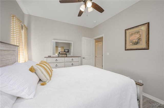 bedroom featuring ceiling fan and baseboards