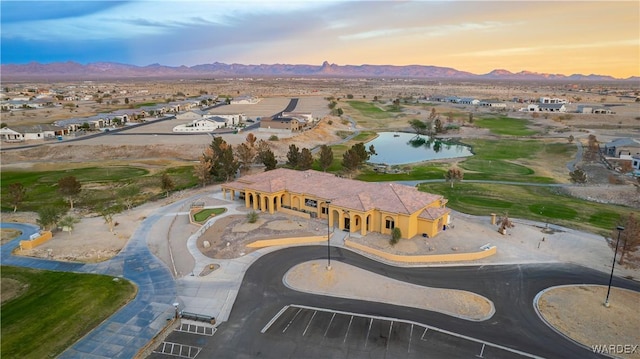 aerial view at dusk with a water and mountain view