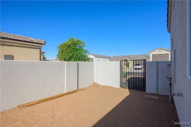 view of gate with fence private yard