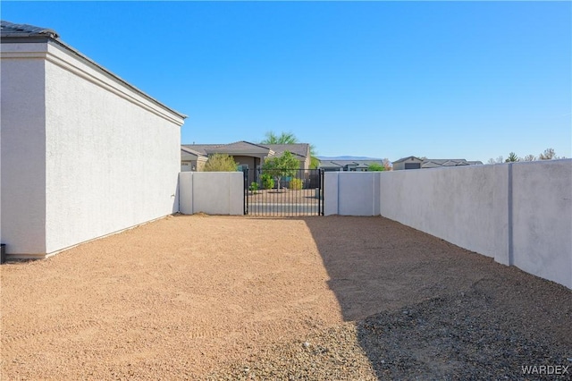 view of yard featuring a gate and fence