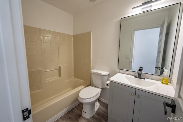 full bath featuring shower / tub combination, vanity, toilet, and wood finished floors