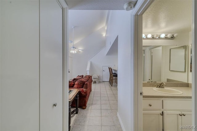 bathroom with tile patterned flooring and vanity