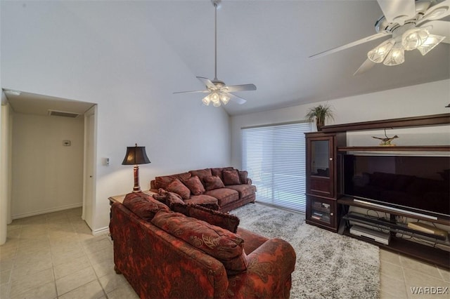 living room featuring visible vents, ceiling fan, light tile patterned floors, and high vaulted ceiling