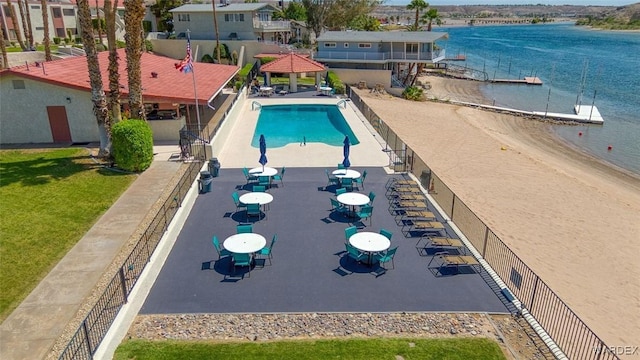 pool featuring a water view, a gazebo, and a yard