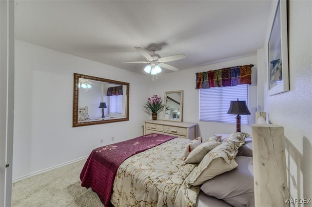 bedroom with baseboards, a ceiling fan, and carpet flooring