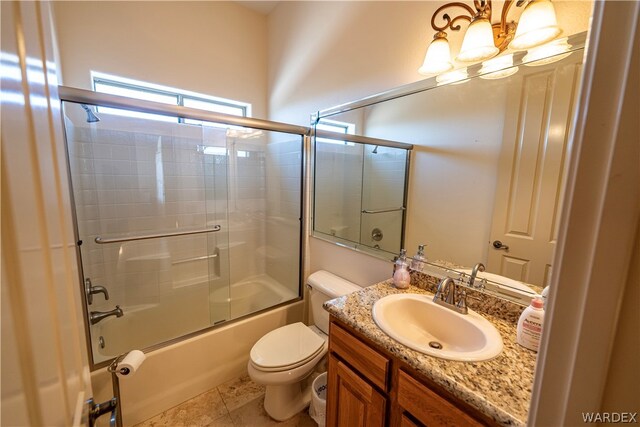 full bathroom featuring toilet, a notable chandelier, shower / bath combination with glass door, vanity, and tile patterned floors