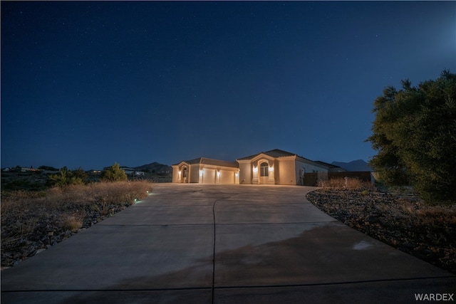 view of front of home with a garage and driveway