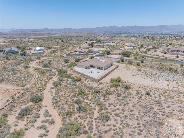 drone / aerial view with a mountain view and a desert view