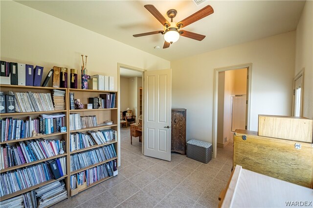 interior space with ceiling fan and light tile patterned flooring